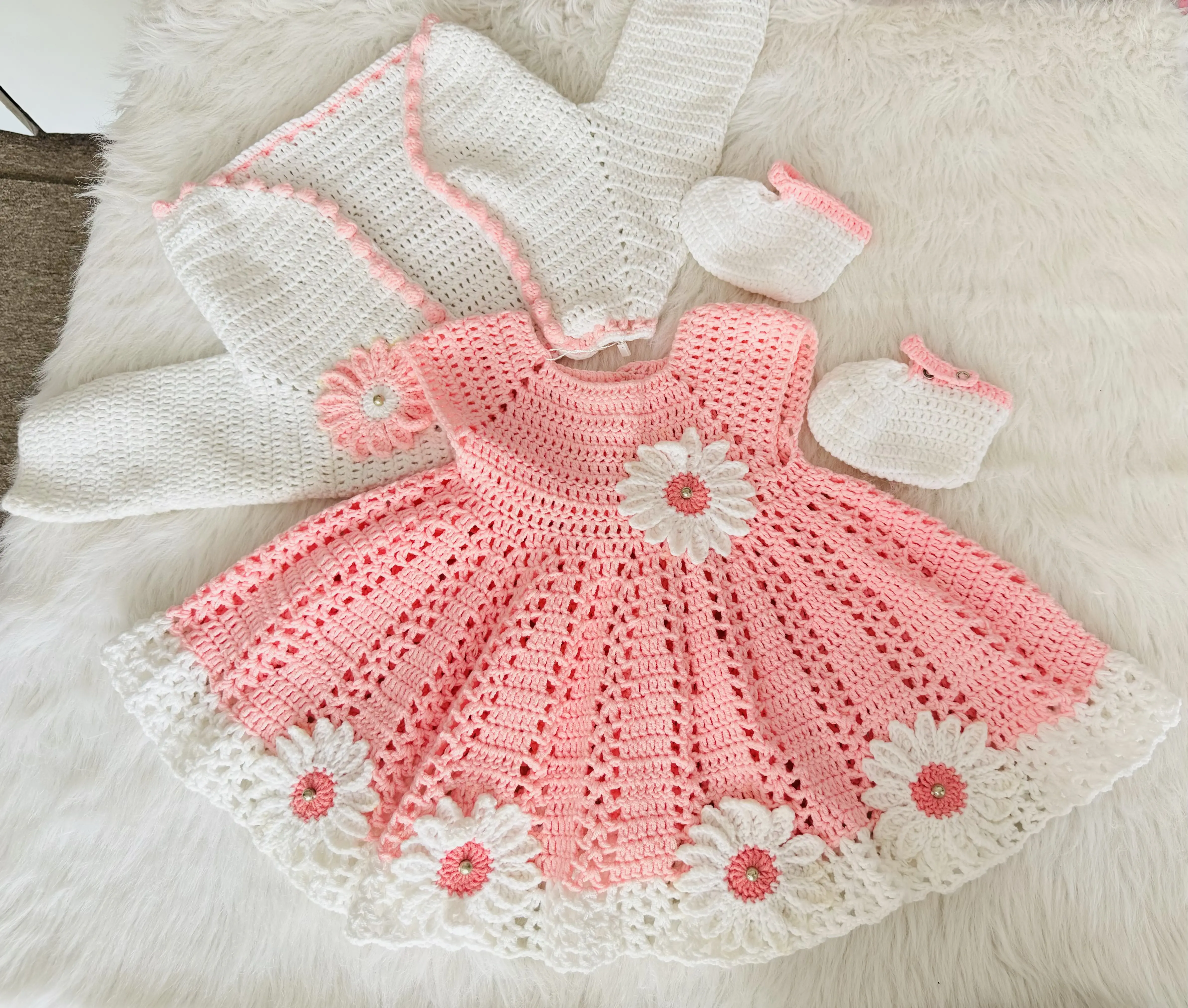 Pink baby crochet dress with daisy details